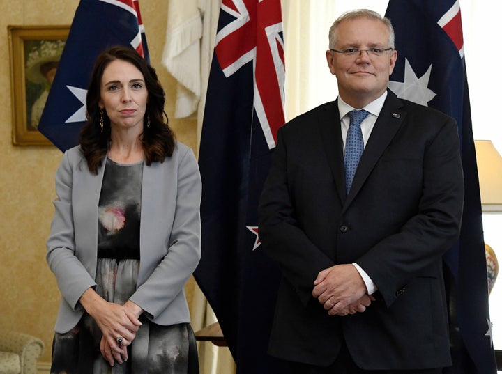 New Zealand Prime Minister Jacinda Ardern, left, stands with Australian Prime Minister Scott Morrison during the signing of the Indigenous Collaboration Arrangement at Admiralty House in Sydney, Friday, Feb. 28, 2020. A (Bianca De Marchi/Pool Photo via AP)