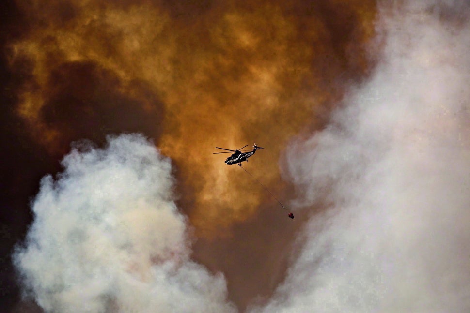 A helicopter battles a wildfire in Fort McMurray, Alta., on May 4, 2016. 