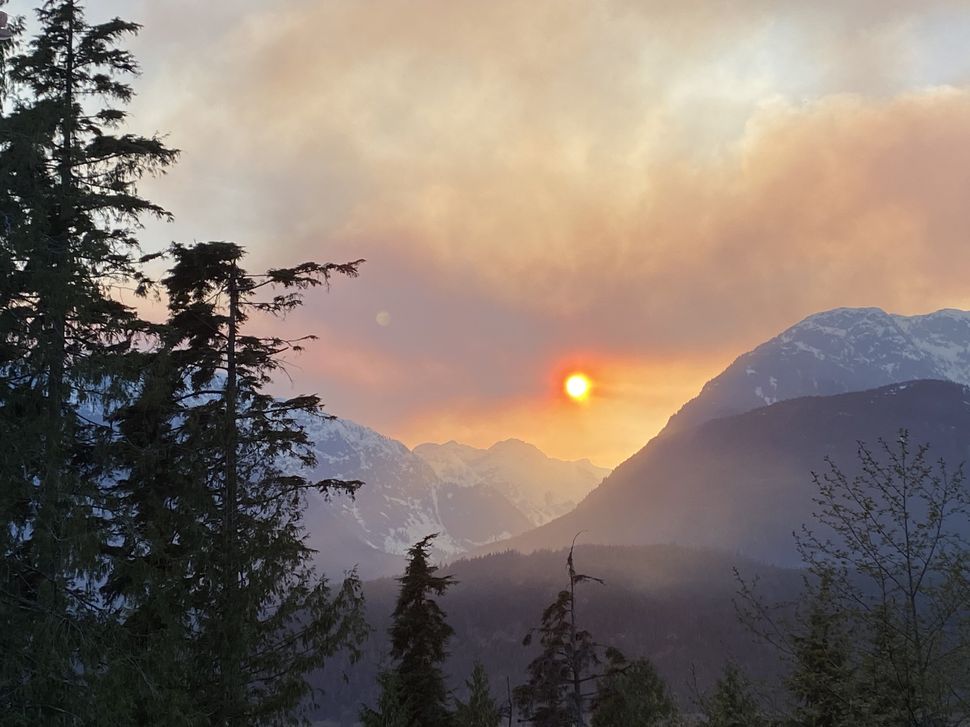 Smoke from a wildfire hangs over the mountains in Squamish, B.C., on April 15, 2020.