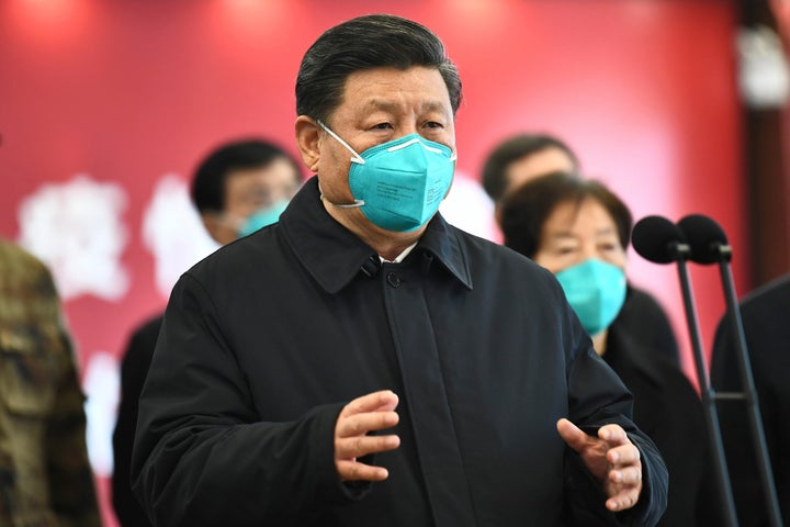 In this Tuesday, March 10, 2020, photo released by China's Xinhua News Agency, Chinese President Xi Jinping talks by video with patients and medical workers at the Huoshenshan Hospital in Wuhan in central China's Hubei Province. (Xie Huanchi/Xinhua via AP)