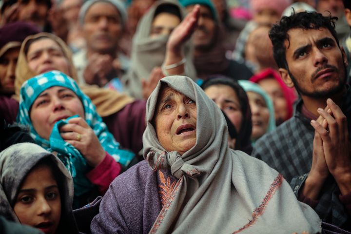 Kashmiri Muslim devotees offer prayer outside the shrine of Sufi saint Sheikh Syed Abdul Qadir Jeelani in Srinagar, Dec. 9, 2019. Hundreds of devotees gathered at the shrine for the 11-day festival that marks the death anniversary of the Sufi saint. The image was part of a series of photographs by Associated Press photographers which won the 2020 Pulitzer Prize for Feature Photography. (AP Photo/Mukhtar Khan)