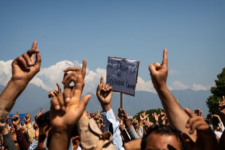 Kashmiri men shout freedom slogans during a protest against the abrogation of Article 370 after Friday prayers on the outskirts of Srinagar, Aug. 23, 2019. The image was part of a series of photographs by Associated Press photographers which won the 2020 Pulitzer Prize for Feature Photography. (AP Photo/Dar Yasin)