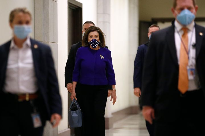 House Speaker Nancy Pelosi of Calif., arrives for a news conference to announce members of the House Select Committee on the Coronavirus Crisis on Capitol Hill in Washington, Wednesday, April 29, 2020. (AP Photo/Patrick Semansky)