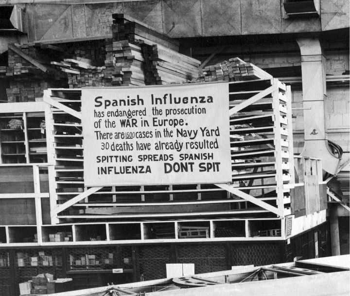 In this Oct. 19, 1918 file photo provide by the U.S. Naval History and Heritage Command a sign is posted at the Naval Aircraft Factory in Philadelphia that indicates, the Spanish Influenza was then extremely active. (U.S. Naval History and Heritage Command via AP)