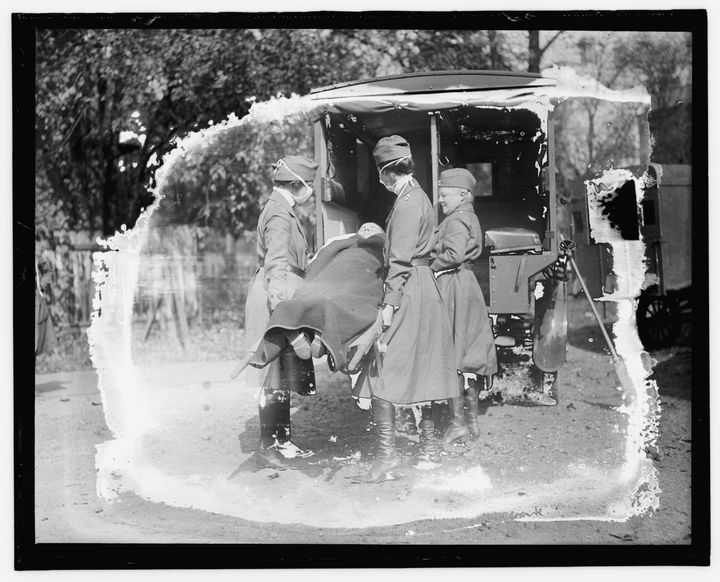 This Library of Congress photo shows a demonstration at the Red Cross Emergency Ambulance Station in Washington, D.C., during the influenza pandemic of 1918. (Library of Congress Prints and Photographs Division via AP)