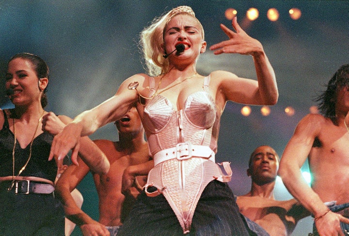 Madonna performs with her dancers during her Blond Ambition tour on June 4, 1990.