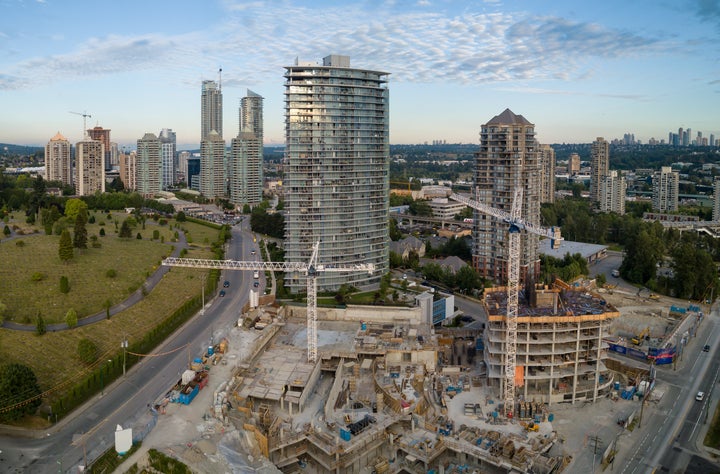 An aerial view of condo towers under construction in the Greater Vancouver city of Burnaby, B.C. Greater Toronto and Greater Vancouver are reporting steep drops in home sales amid the COVID-19 pandemic.