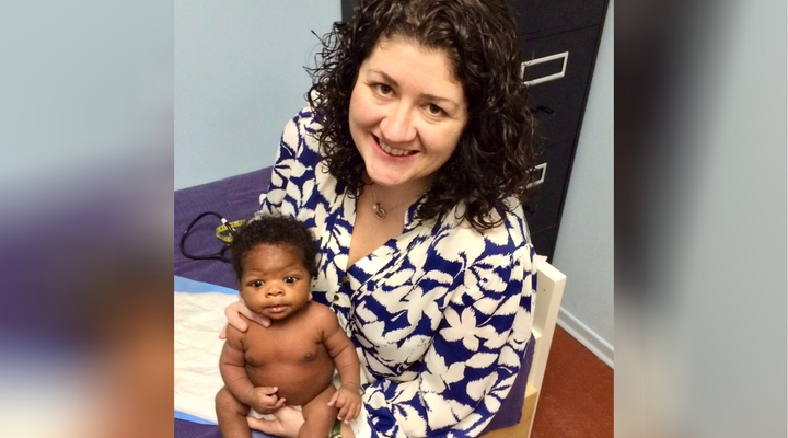 Toronto midwife Christie Lockhart and a client's baby before the pandemic. 