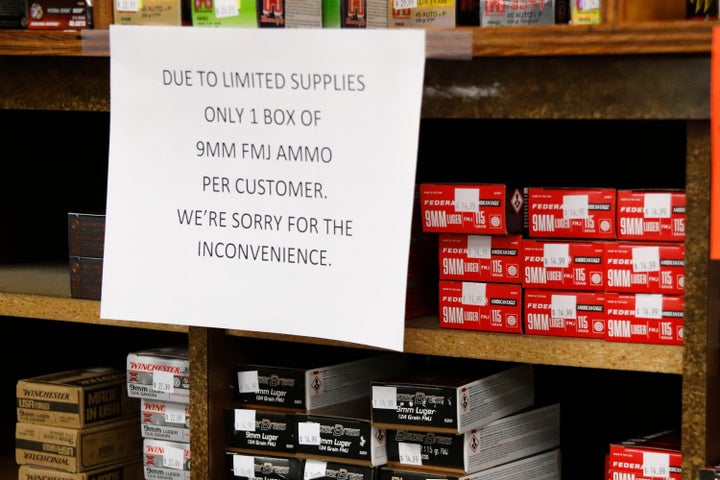 Signs point out quantity limits on certain types of ammunition after Dukes Sport Shop reopened, Wednesday, March 25, 2020, in