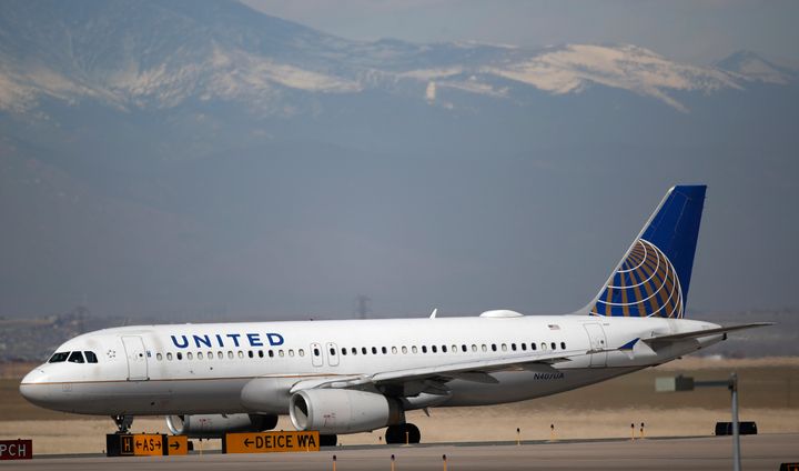 A United Airlines jetliner taxis down a runway for takeoff from Denver International Airport. The airliner has asked employees to consider leaving the company ahead of its downsizing of staff due to the coronavirus pandemic.