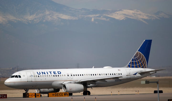 A United Airlines jetliner taxis down a runway for takeoff from Denver International Airport. The airliner has asked employee