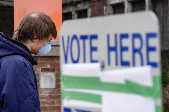 A voter in Milwaukee arrives at a polling place for Wisconsin's controversial April 7 primary election, held despite concerns about the coronavirus pandemic.
