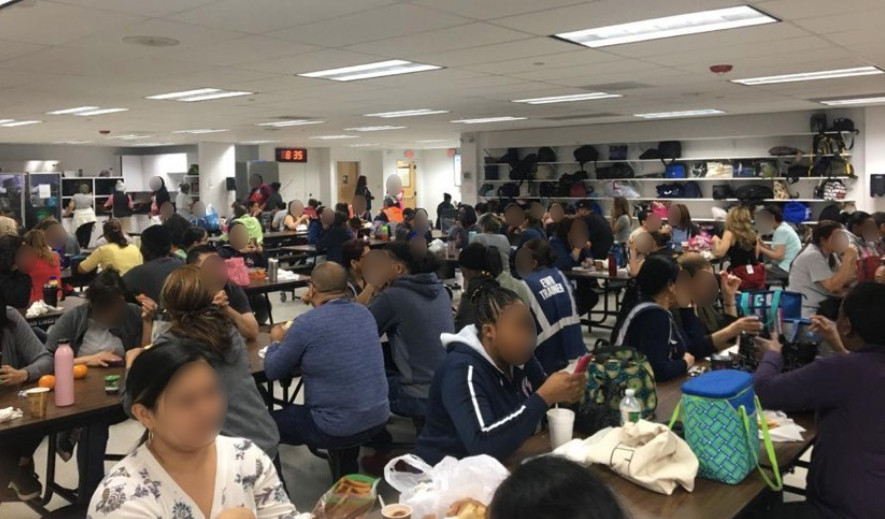 Photos and videos provided to HuffPost show Secaucus warehouse employees sitting side-by-side without gloves or masks in the midst of the pandemic.