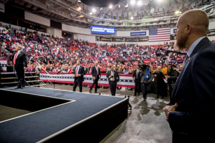 Brad Parscale, manager of President Donald Trump's reelection campaign, right, watches as Trump ends a rally April 27 in Green Bay, Wis.