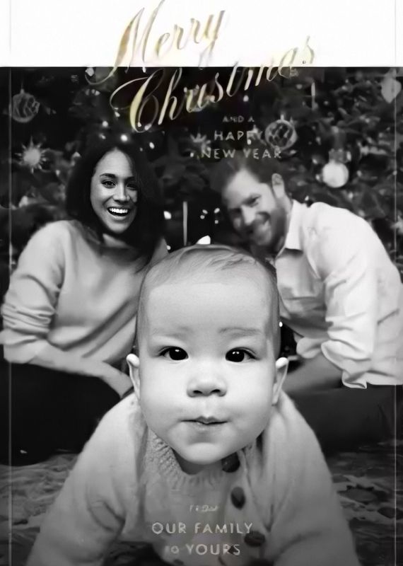 Archie crawls front and center in their first Christmas card as a family of three.&nbsp;