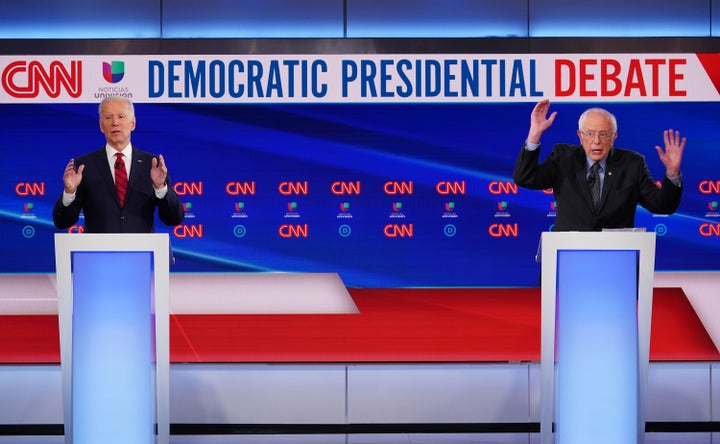Democratic presidential hopefuls former US vice president Joe Biden (L) and Vermont Senator Bernie Sanders (R) take part in t