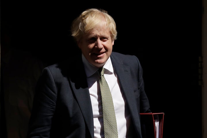 <strong>British Prime Minister Boris Johnson leaves 10 Downing Street in London, to attend his first weekly Prime Minister's