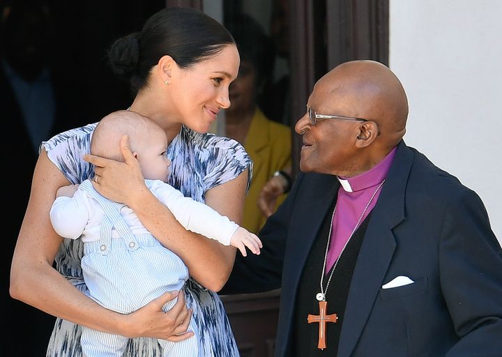 Meghan Markle holds baby Archie while chatting with Archbishop Desmond Tutu at the Desmond & Leah Tutu Legacy Foundation in Cape Town on September 25.