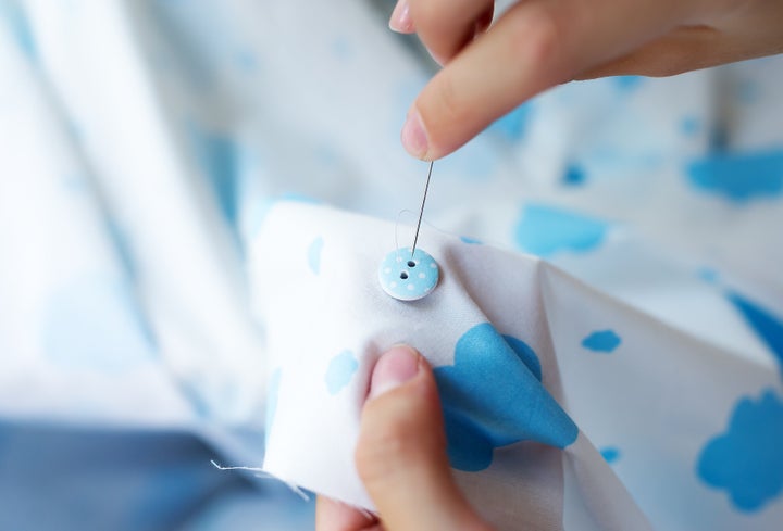 One of the mending tasks that might be the best project for beginners is learning how to hand sew a button back on when it pops off.