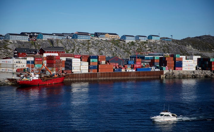 Containers are stacked at a port in Nuuk on July 29, 2017. Cargo ships sailing through the Northwest Passage could potentiall