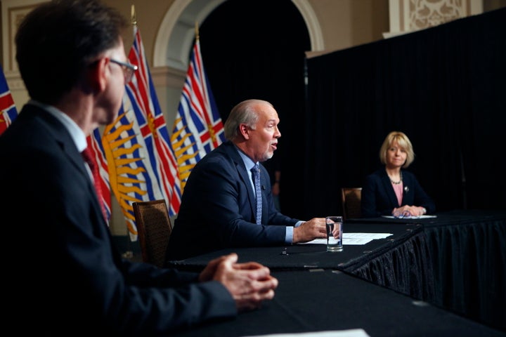 Premier John Horgan, Dr. Bonnie Henry and Health Minister Adrian Dix discuss reopening B.C.'s economy in phases in response to the COVID-19 pandemic during a press conference in Victoria, on May 6, 2020.