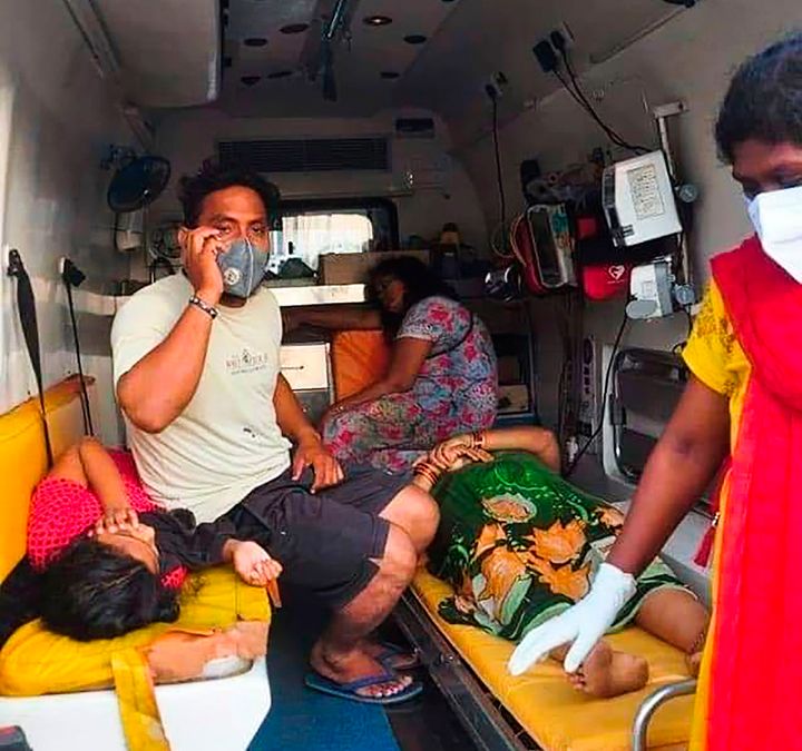 Women are evacuated to a hospital in an ambulance following a gas leak incident from an LG Polymers plant in Visakhapatnam on May 7, 2020. 