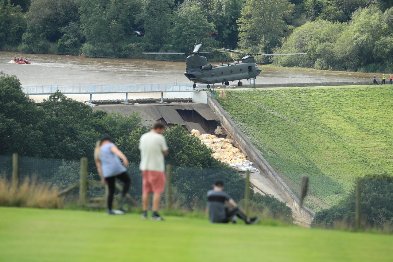 <strong>An RAF Chinook helicopter flies in sandbags to help repair the dam at Toddbrook reservoir near the village of Whaley Bridge in Derbyshire last year.</strong>