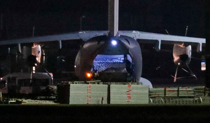An RAF Atlas, believed to be carrying a cargo of PPE, is unloaded at Brize Norton.
