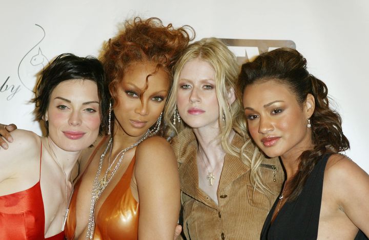 Tyra Banks in 2004 with Cycle 2 contestants Yoanna House, Shandi Sullivan and Mercedes Scelba-Shorte.