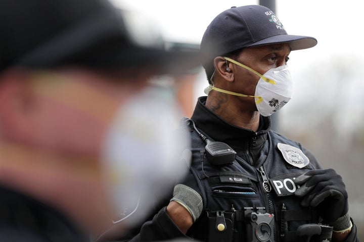 A Seattle police officer wears an N95 mask.