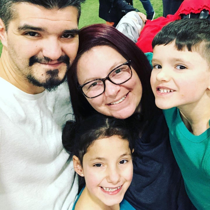 Nadia Barberio is pictured with her children and husband. Barberio says she has no choice but to send her kids back to school, but she is uncomfortable with the guidelines students have to follow.