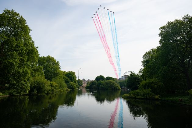 The Royal Air Force Red Arrows pass over The London Eye and St James's Park in central London during a flypast to mark the 75th anniversary of VE Day.