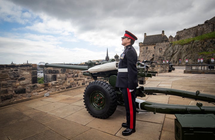 Sergeant David Beveridge prepares to fire a Gun Salute from the ramparts of Edinburgh Castle, to mark the start of the two-minute silence on the 75th anniversary of VE Day.