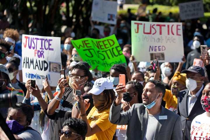 Demonstrators in Brunswick, Georgia, gather Friday to protest the shooting of Ahmaud Arbery, an unarmed Black man killed while jogging in February. Two men have been charged with the murder of Arbery, whom they had pursued in a truck after spotting him running in their neighborhood.