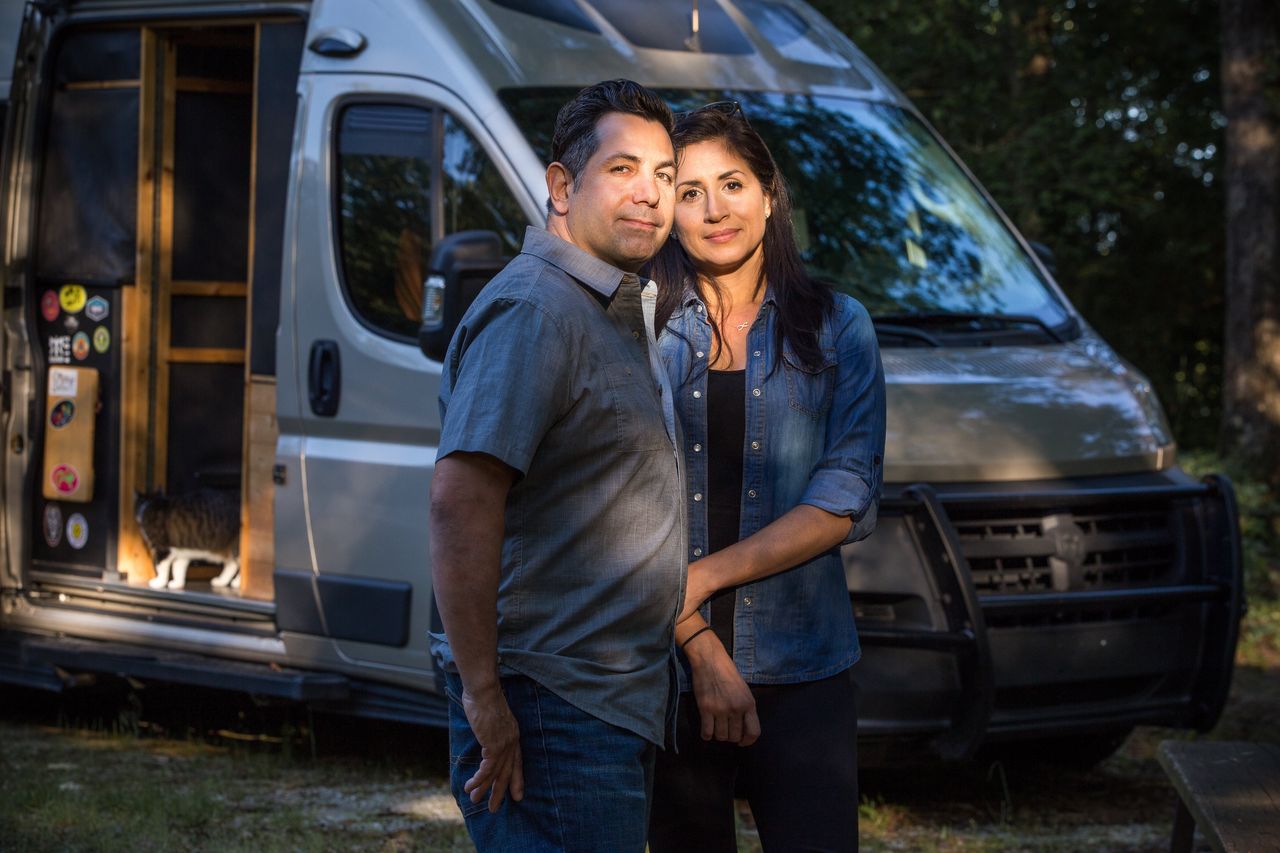 Denny Winkowski and Veronica Ibañes by their RV at Carolina Landing RV Resort in Fair Play, South Carolina, on May. The couple, who have lived and worked full time from an RV since 2013, have run into difficulty while attempting to adhere to shelter-in-place protocols.