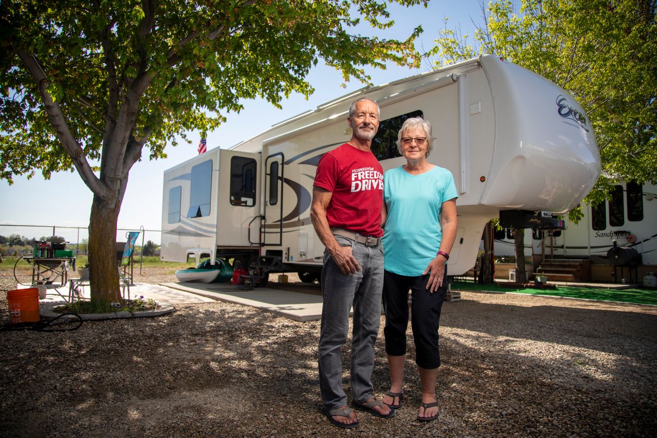 Jean and Duane Mathes with their RV home at the Hi Valley RV Park in Eagle, Idaho. Jean and Duane made it to their reservation at Hi Valley but found many RV parks closed on their way to Idaho from Arizona.