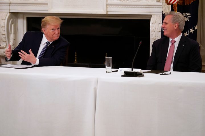 President Donald Trump speaks with House Minority Leader Kevin McCarthy (R-Calif.) during a meeting with Republican lawmakers Friday at the White House.
