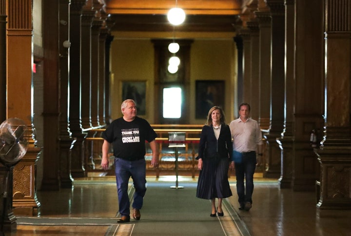 Ontario Premier Doug Ford, Health Minister Christine Elliott and Environment Minister Jeff Yurek arrive for a daily COVID-19 press conference at Queen's Park on May 9, 2020.