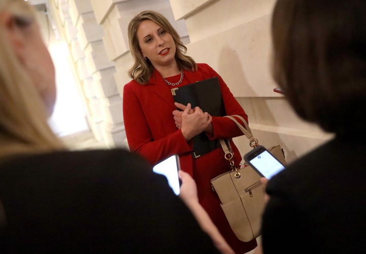 Rep. Katie Hill answers questions from reporters at the U.S. Capitol following her final speech on the floor of the House of