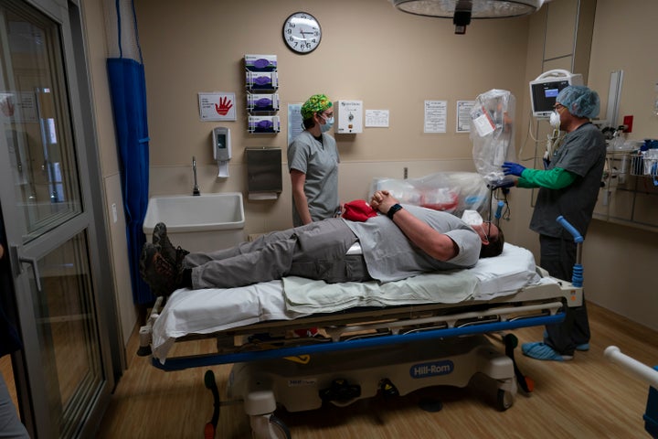 On April 23, medical workers at Kayenta Health Center on the Navajo Nation reservation prepare to practice with a new intubation shield to use when intubating patients.