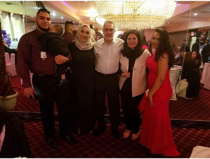 Rami Mohamed, 28, pictured with his parents and sisters.