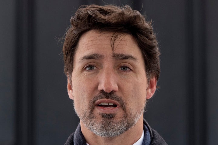 A stray flyway foreshadows what's to come as Prime Minister Justin Trudeau speaks to the media about the COVID-19 virus in Ottawa on March 17, 2020.