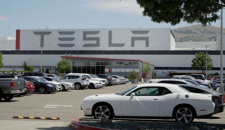 Tesla's Fremont plant in California, with a parking lot full of cars, on May 11, 2020.