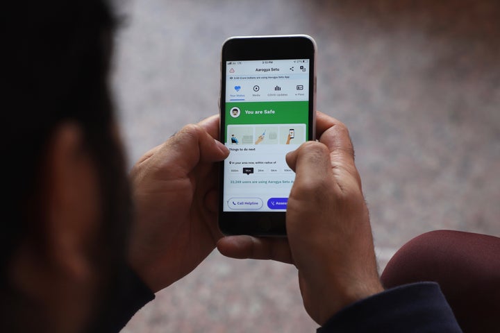 A man uses Aarogya Setu App on his mobile phone in New Delhi, India on 08 May 2020 (Photo by Nasir Kachroo/NurPhoto via Getty Images)