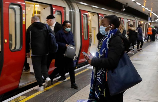 People wearing face masks on the Tube on Tuesday