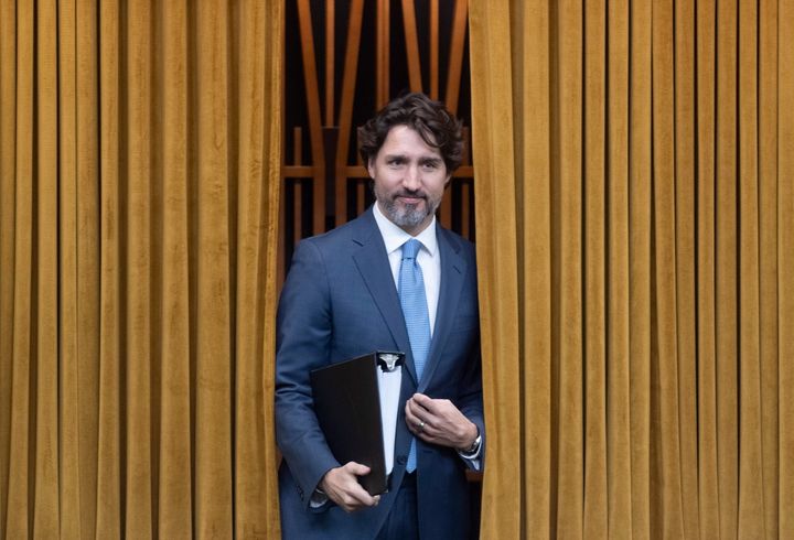 Prime Minister Justin Trudeau walks through the curtains before a session of the Special Committee on the COVID-19 Pandemic to begin in the Chamber of the House of Commons in Ottawa May 13, 2020. 
