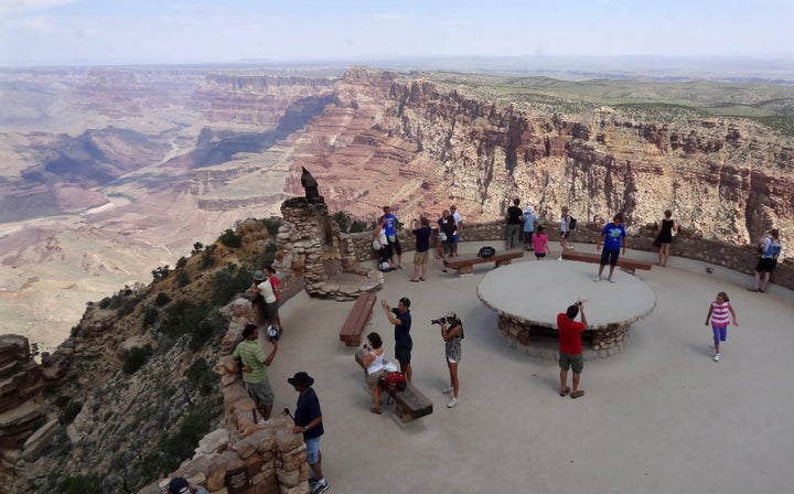 Tourists gather at the South Rim of the Grand Canyon near Tusayan, Arizona, in August 2012.
