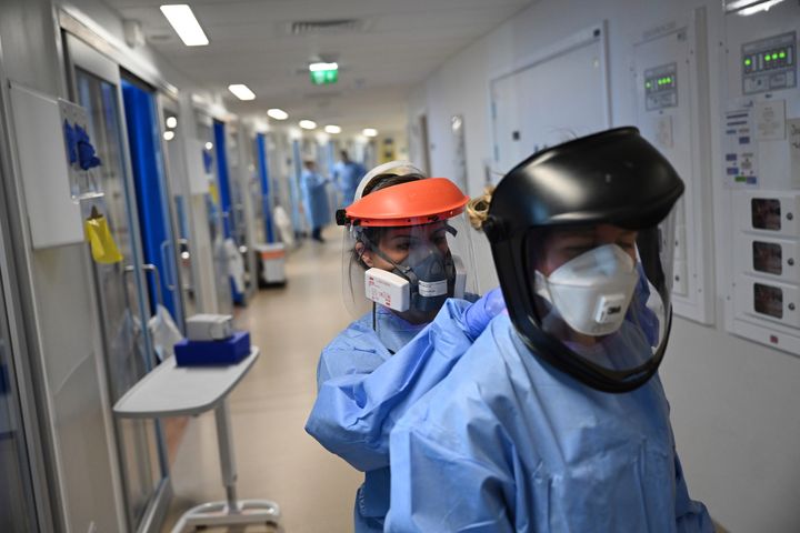Medics wear PPE as they care for patients with coronavirus in the intensive care unit at the Royal Papworth Hospital in Cambridge