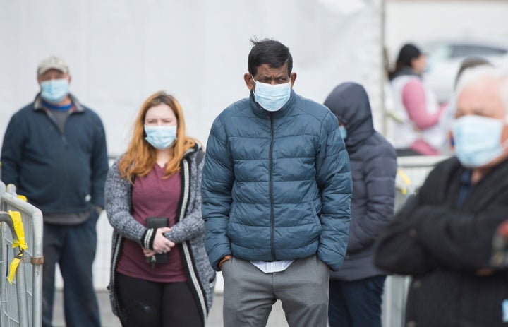 People wait in line at a COVID-19 walk-in test clinic in Montreal North on May 10, 2020.