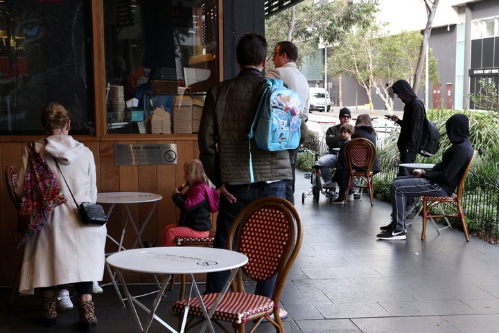 Customers sit at a cafe on the first morning of eased coronavirus disease (COVID-19) restrictions, allowing up to 10 patrons to sit at a time inside establishments previously only opened for take-away, in Sydney, New South Wales, Australia, May 15, 2020. 